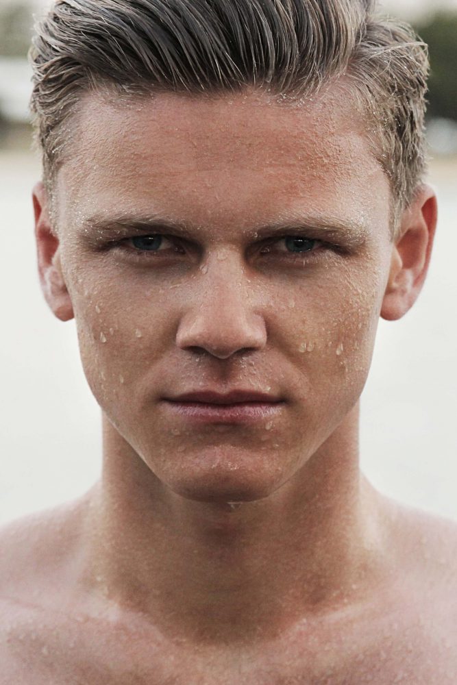 the face of a man with water drops